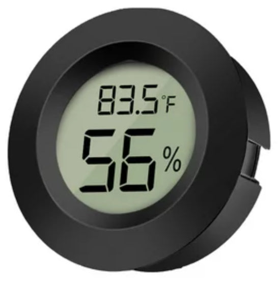 Round thermometer displays temperatures in Fahrenheit or Celsius